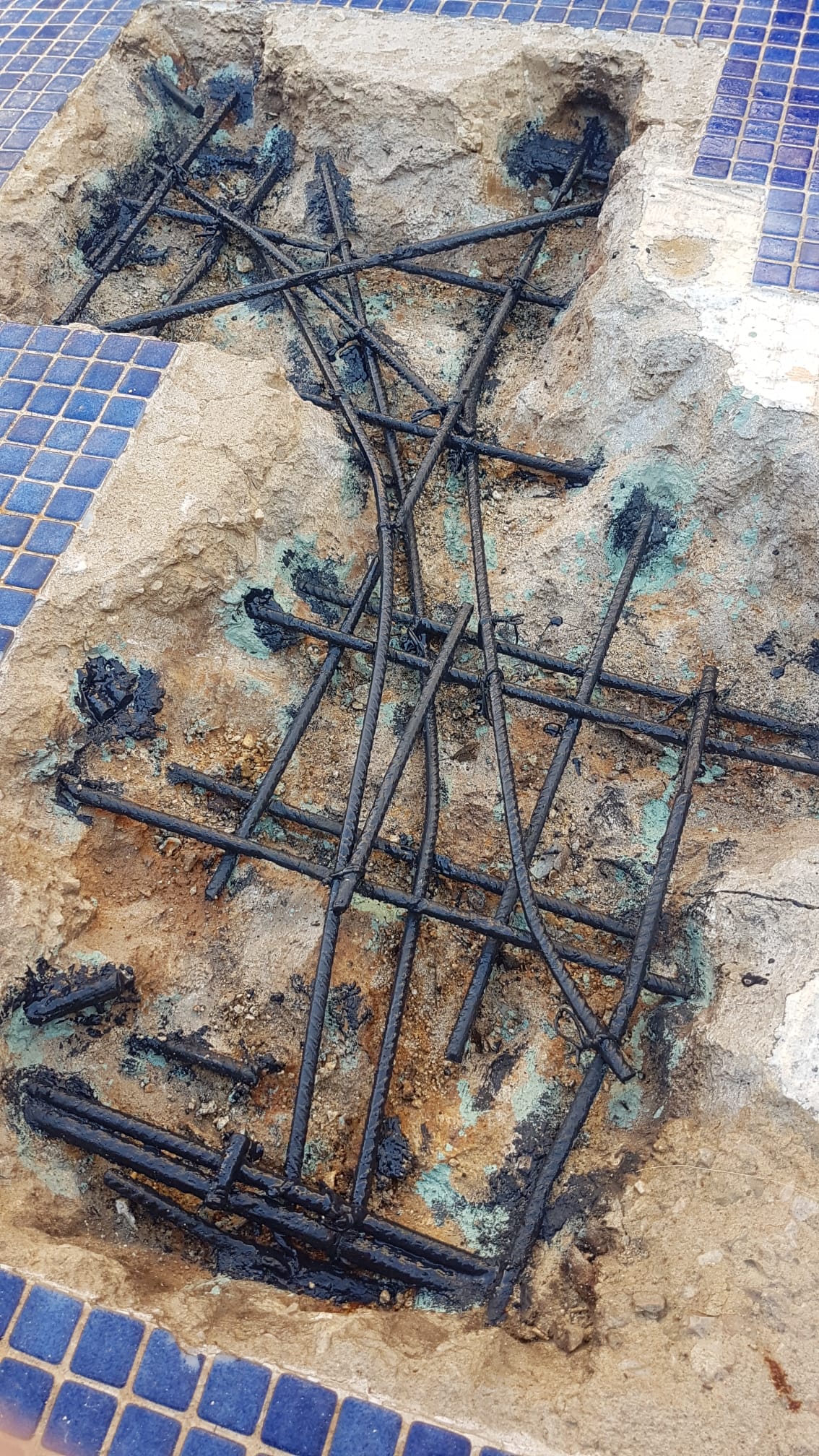 Rebar coated with anti-corrosion paint in pool shell